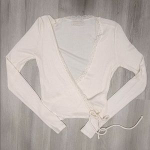 This is a Urban Outfitters tie sweater/shirt, it has been worn once.